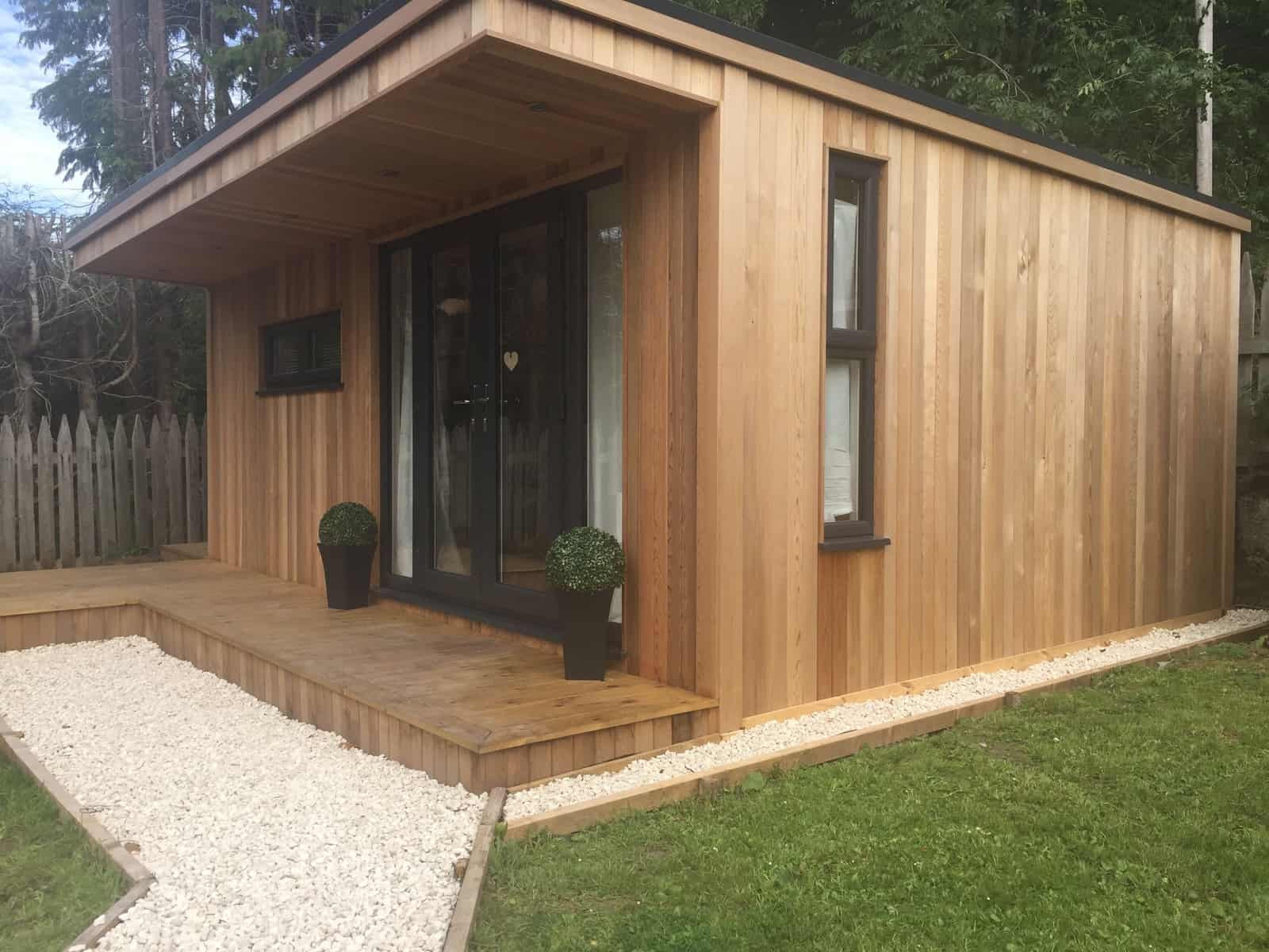 Garden room with storage. Side view in recently landscaped garden
