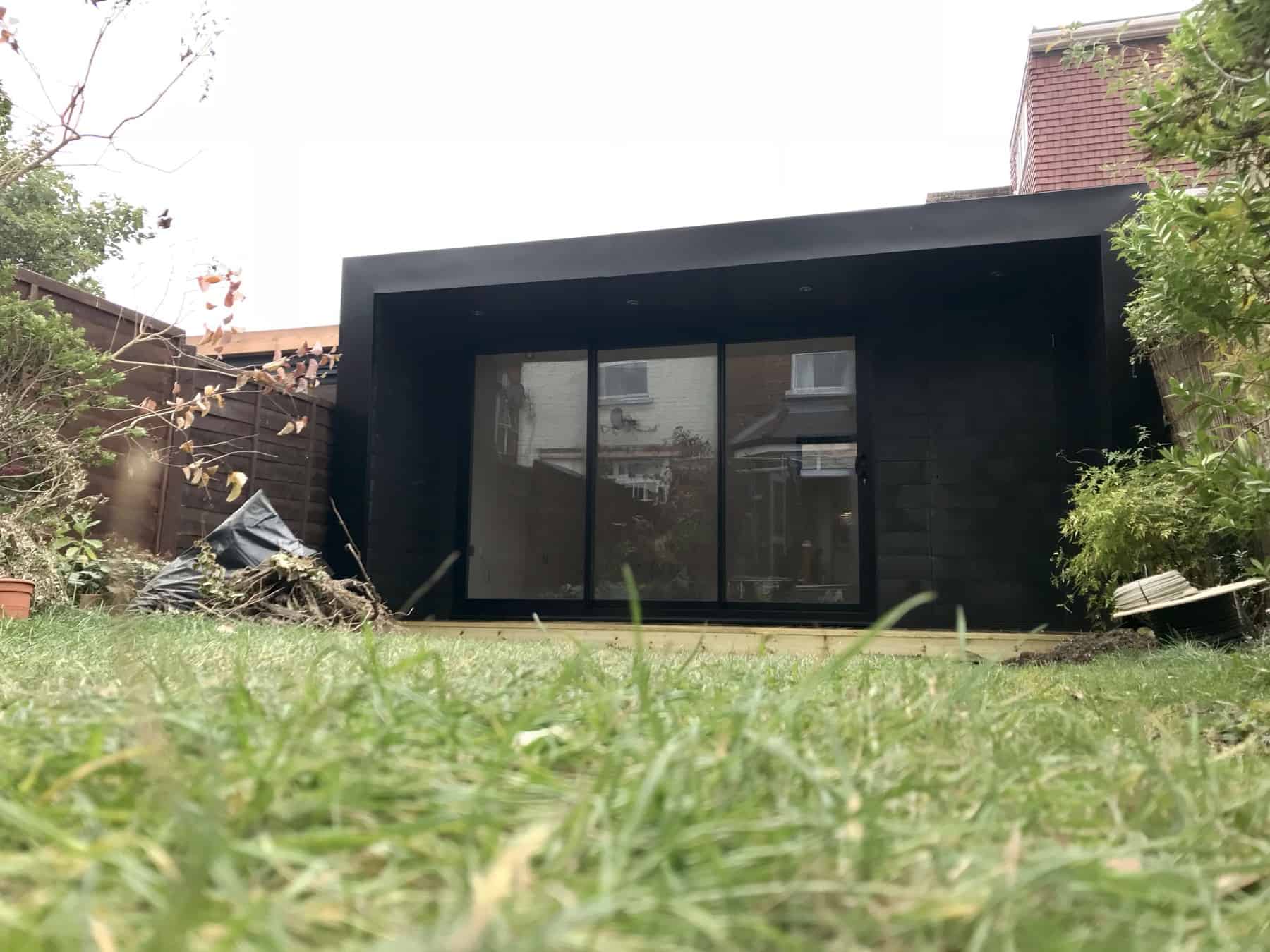 Composite garden room, with sliding patio doors and hidden shed