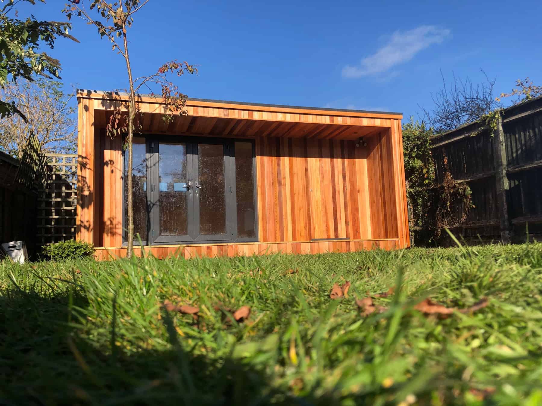 Concave Garden Office with a secret shed door